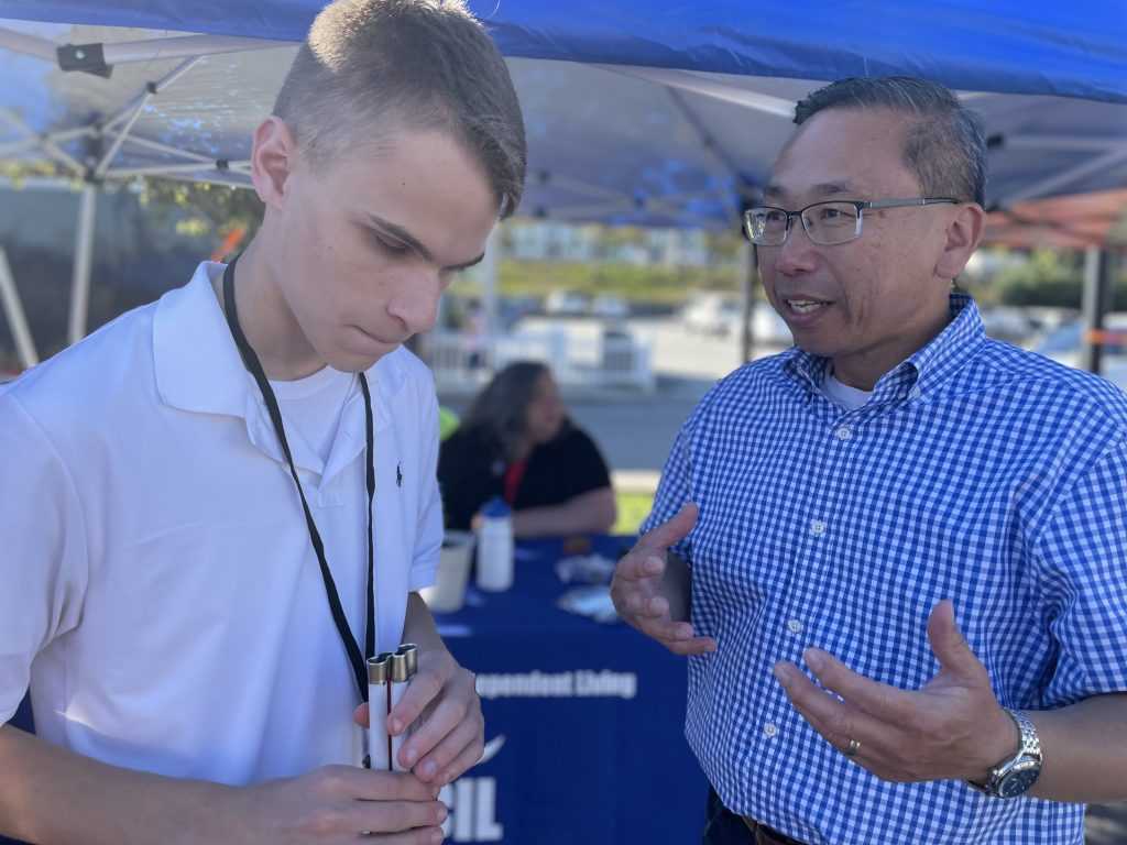 Ryan Lukowicz speaks to Congressional candidate Allan Fung.